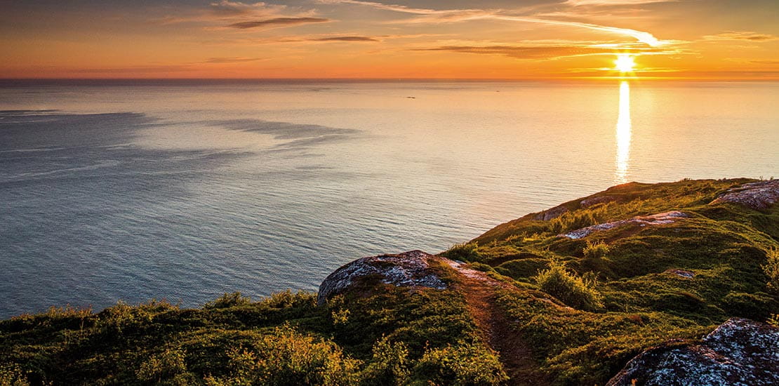 The midnight sun over the landscapes of Norway